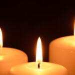 Three lit candles
